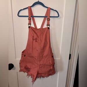 Pink Distressed Jumpsuit with Adjustable Straps